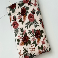 this floral book sleeve has a light brown background with different shades of brown flowers & the leaves are dark green this floral book sleeve has a light brown background with different shades of brown flowers & the leaves are dark green
