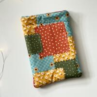 this fall kindle sleeve has fall color patchwork with different prints on each block this fall kindle sleeve has fall color patchwork with different prints on each block