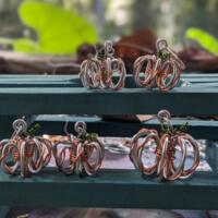 Wire pumpkin earrings handmade in NC by Bendi's Jewelry 
Silver wire wrapped with copper wire and green wire shapes curly vine