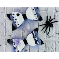 Two different styles of Black, white and lavender purple Halloween hair bows. See next photos for more details. Bows are sold individually.  Two different styles of Black, white and lavender purple Halloween hair bows. See next photos for more details. Bows are sold individually.