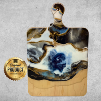 Maple charcuterie board with a resin and bison design, 24K gold accents, and a protective finish. Perfect for gifts or entertaining. Maple charcuterie board with a resin and bison design, 24K gold accents, and a protective finish. Perfect for gifts or entertaining.