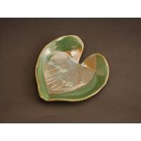 6x6" heart shaped plate with Hosta plant texture. Glazed with a dark green rim and a mixture of blue and grey throughout the middle.  6x6" heart shaped plate with Hosta plant texture. Glazed with a dark green rim and a mixture of blue and grey throughout the middle.