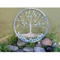 5 inch yarn wrapped hoop is the background for this wire tree adorned with various beads 5 inch yarn wrapped hoop is the background for this wire tree adorned with various beads