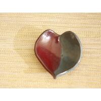 Ceramic heart shaped spoon rest. Glazed in red and blue. Approximately 3"x3.5" Ceramic heart shaped spoon rest. Glazed in red and blue. Approximately 3"x3.5"