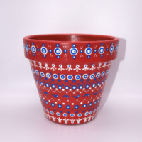 Full front view of hand painted, repurposed, gently used, flower pot with dot art painted around the pot's entirety.