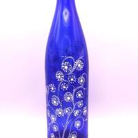 Full front view of one side of the bottle.  The 2 painted sides are not identical