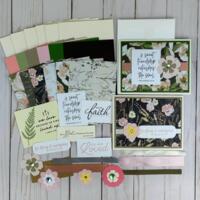 A religious DIY card kit with cardstock, scrapbook paper, handcrafted embellishments, scripture sentiments and cards/envelopes for 6 cards.