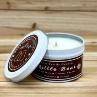 Cool mint and creamy vanilla scented soy candle in 6oz tin with lid off.