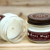 Banana bread scented soy candle in 4oz mason jar. One jar standing up with lid on and one jar on its side with lid off.