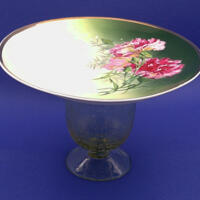 The flowers in the dish are a nice variety of pink. The dish is roughly 5 inches high by 7 inches wide.