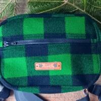 Green & black check wool hunting belt bag handcrafted from Johnson Woolen Mills virgin wool. Rugged outdoorsman waist pack for deer hunting. Green & black check wool hunting belt bag handcrafted from Johnson Woolen Mills virgin wool. Rugged outdoorsman waist pack for deer hunting.