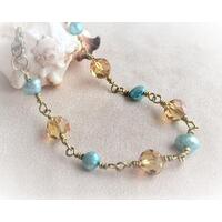 Wire wrapped bracelet topaz and aqua beads