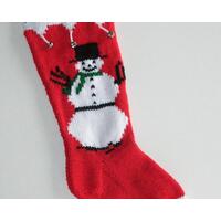 Snowman with green scarf on red and white hand knit Christmas stocking, personalized at top, and embellished with silver bells.