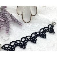 Black lace bracelet made with tatting method Black lace bracelet made with tatting method
