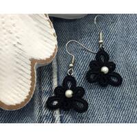 Small triangle shaped black earrings with pearl center Small triangle shaped black earrings with pearl center