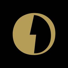 O Kim logo.  Gold circle outline with a lightning bolt separating the gold (left) and black (right), on a black background.