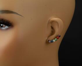 Rainbow Ear Crawlers shown on a mannequin's ear sweeping up from bottom towards top