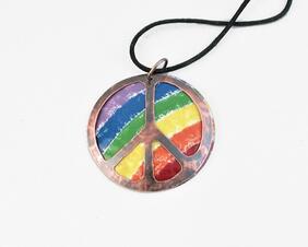 2 inch diameter copper enamel rainbow with peace symbol cutout on front