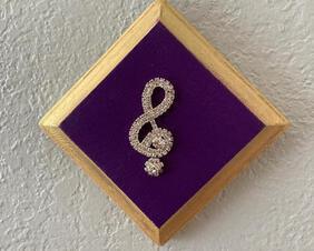Wood Music Plaque in purple, 18k gold trim and brilliant treble clef with rhinestones.Available in green, red, and blue. These are handcrafted from the wood and router, sander, and saw were used.  They are also hand painted and have wall attachment in color of the main wood.