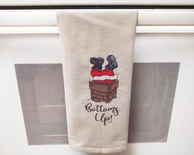 Upside Down Santa Towel
Bring some fun into your kitchen during the holiday season with this funny machine embroidered Santa stuck in the chimney towel.  Use to towel dry dishes or just hang it over the stove handle for a laugh while you prepare dinner.

    What you get:  One machine embroidered Santa stuck in the chimney "Bottoms Up!"  dish towel.

    Towel color:  Solid tan flat weave towel.

    Materials used:  Cheerful colors of polyester machine embroidery thread and cutaway stabilizer.

    Size:  18 inches x 27 inches. Dish towel has been preshrunk.

    Care:  Hand- or machine wash in cold water with like colors, may be tumbled dried, remove promptly to avoid wrinkles. Press with warm iron if necessary, on backside.  NO Bleach.
    Listing is for one Santa kitchen towel only.  Spoon, cutting board, and bowl of eggs are not included.

**NOTE:  all towels I have in my shop are meant to be decorative and are NOT meant for heavy duty use.  They can withstand light daily use, and light washing.