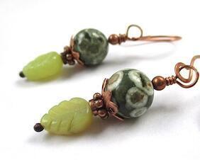 Copper accents these rhyolite and olive jade woodland boho earrings in fall fashion jewelry design for women.