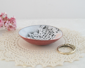 tiny copper enameled trinket dish pink hearts and charcoal gray stenciled lacy design on white background
