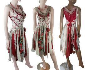 A striking red, cream and gray, knee length tattered dress. Featuring crochet around the bodice and a tie up waist for a snug fit. Fringe around the neckline and a red rose on one hip. One of a kind, handmade, eco-friendly bohemian style dress.