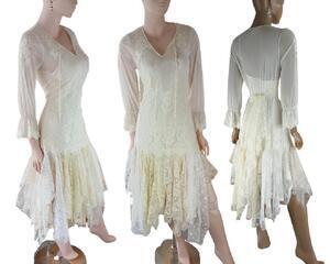 A cream white flapper style dress with low tatters coming away from just below the hips. Long sleeves and a tie at the back if required. Lace tatters in the skirt. One of a kind, handmade, eco-friendly bohemian style dress.