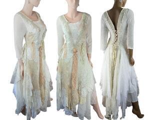 A white, cream and tan long wedding dress. Features lots of crochet on the front with fringe and a lace up back. Beautiful gown. Lots of lace and soft fabrics in the tattered skirt. One of a kind, hand made, eco-friendly bohemian style dress.