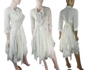 Cream 3/4 sleeve tattered wedding dress. One of a kind, hand stitched with tie up back for a snug fit.