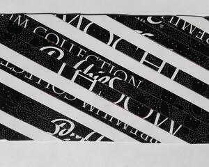 Front side of upcycled card. This card has Black Tie pattern where there is a mix of black and white. Every black strip has tiny white dots.