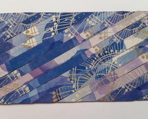 Front side of an upcycled card with the Dreams pattern.  The Dreams pattern refers to the color combination - shades of purple and lavender, light and medium shades of blue, yellow, and white, all create a dreamy combination. The Dreams design is dynamic.