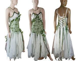 Green and white woodland wedding dress. Lace up back. The bodice has green crochet and flowers and leaves sewn into around the crochet. Lots of white tatters with occasional green. One of a kind, handmade, eco-friendly, bohemian style clothes.