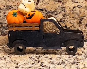 Black Truck with Skulls and Jack O Lanterns
