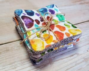 side view of a colorful hears patterned reusable facial square.