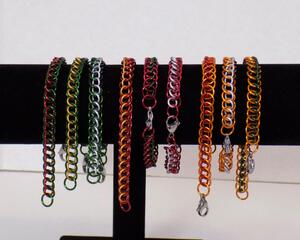 Christmas colored chainmaille bracelets in 1/2 Persian pattern made with anodized aluminum, handmade in the USA by RainbowMaille