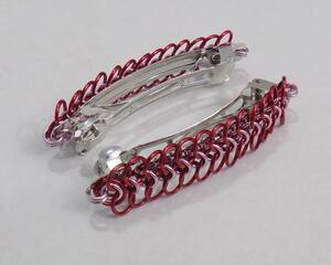 Red and pink chainmaille barrettes made with anodized aluminum in a European 4-in-1 pattern, handmade in the USA by RainbowMaille