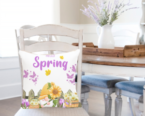 Hello spring pillow cover on a pillow displayed on a dining chair
