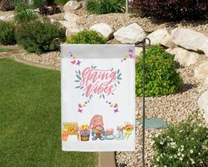 Spring vibes gnome garden flag in a garden landscape