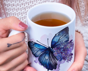 Butterfly and lilac mug in woman's hands
