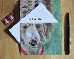 The cute face of a goldendoodle dog is printed on the face of this 5 card pack of note cards. Comes with white envelopes.
