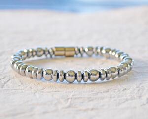 Magnetic bracelet handcrafted with silver metallic magnetic hematite beads. It is secured with a strong and easy-to-use magnetic clasp.