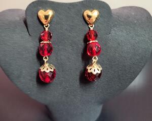 There are 3 beads on each earring. A small and medium bead are wire-wrapped which are attached to a stud at the top and a large bead below.