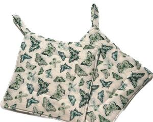 white cotton with darker green butterflies