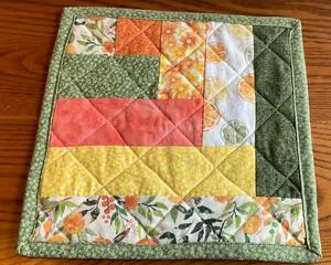 Yellow and Orange 10 inch candle mat, quilted