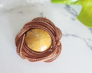 Copper Wire Wrapped Urchin Fossil and Goldstone Pendant