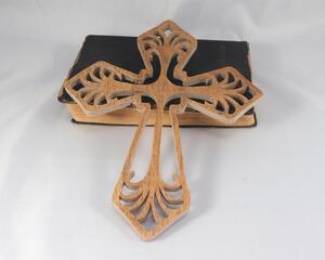 This Ten-Inch Rustic Fretwork Christian Cross Wall Hanging Art is handcrafted from reclaimed wood. Its intricate fretwork design adds unique texture and character, blending rustic charm with elegant design. It is a perfect focal point for any room.