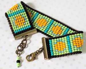 Green and orange seed bead bracelet.