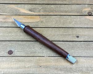 hobby knife with dark wood handle