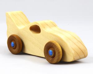 Handmade wooden toy bat car with a clear and amber shellac finish and metallic sapphire blue trim, part of my Play Pal Collection
